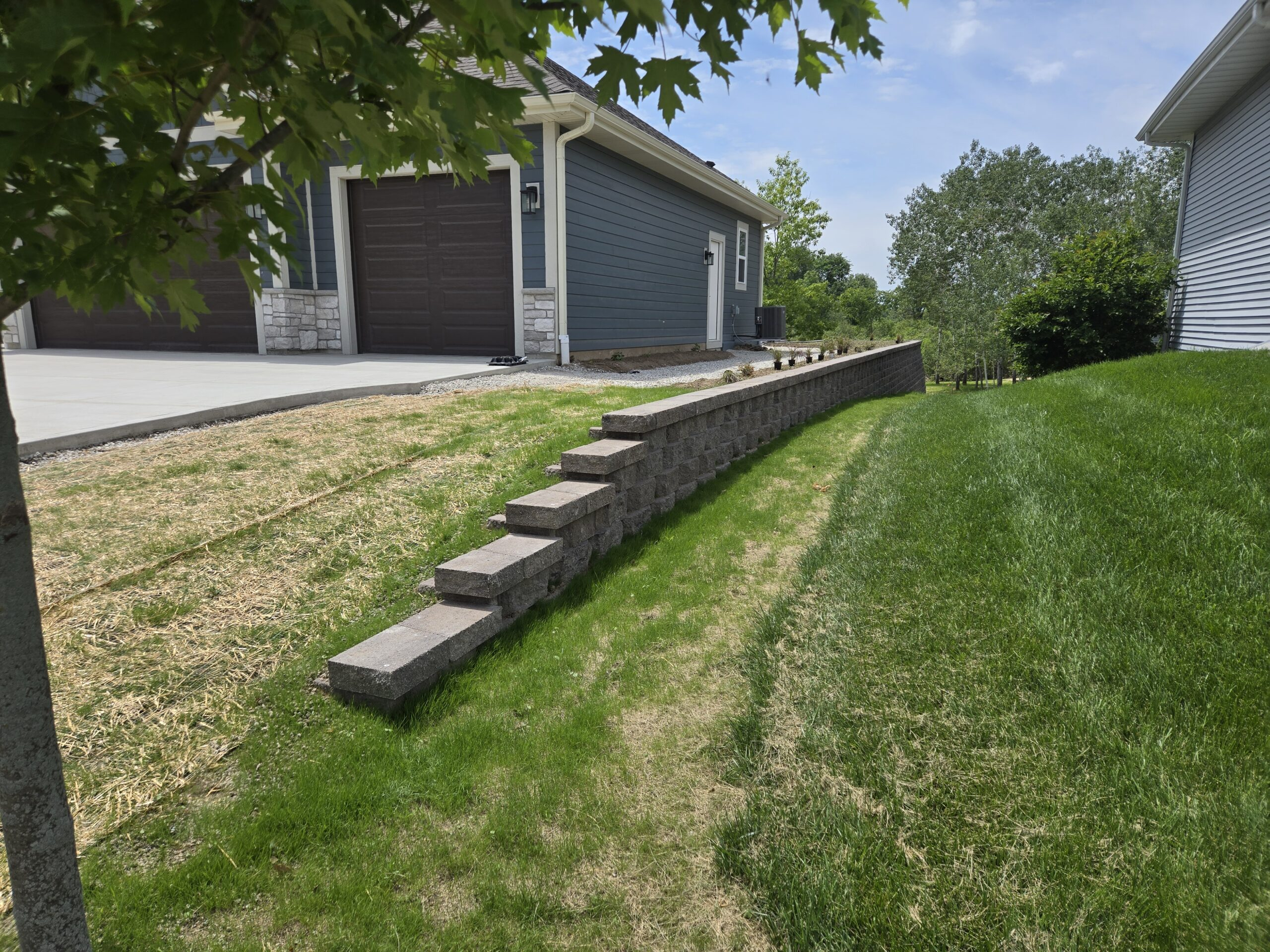 How To Use A Retaining Wall To Level A Sloped Yard For A Patio - Koch Kuts within How Do You Level Out A Yard