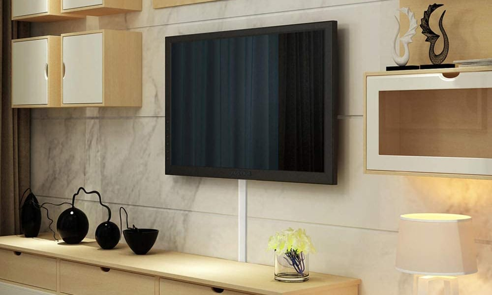 How To Hide Your Tv Wires Without Cutting Into Your Walls - The Plug ... throughout The Hidden Cable Management Tricks Pros Use for Clean Fireplace TV Walls