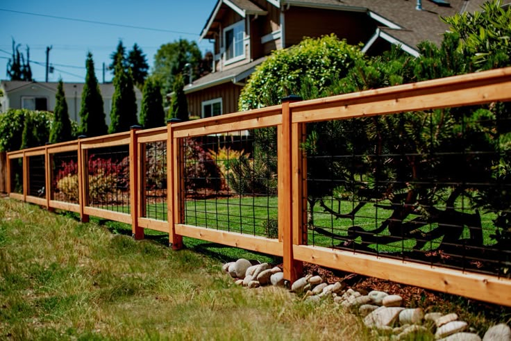 Modern Cedar & Steel Hog Panel Fencing By Eden Fence Co. with regard to Black Metal and Cedar Wood Create the Most Striking Fence Contrast